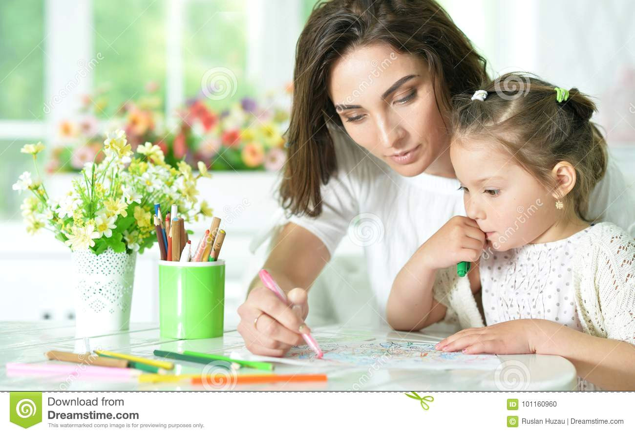 Drawing Of A Girl and Her Mom Mother and Little Daughter Drawing with Pencils Stock Photo Image