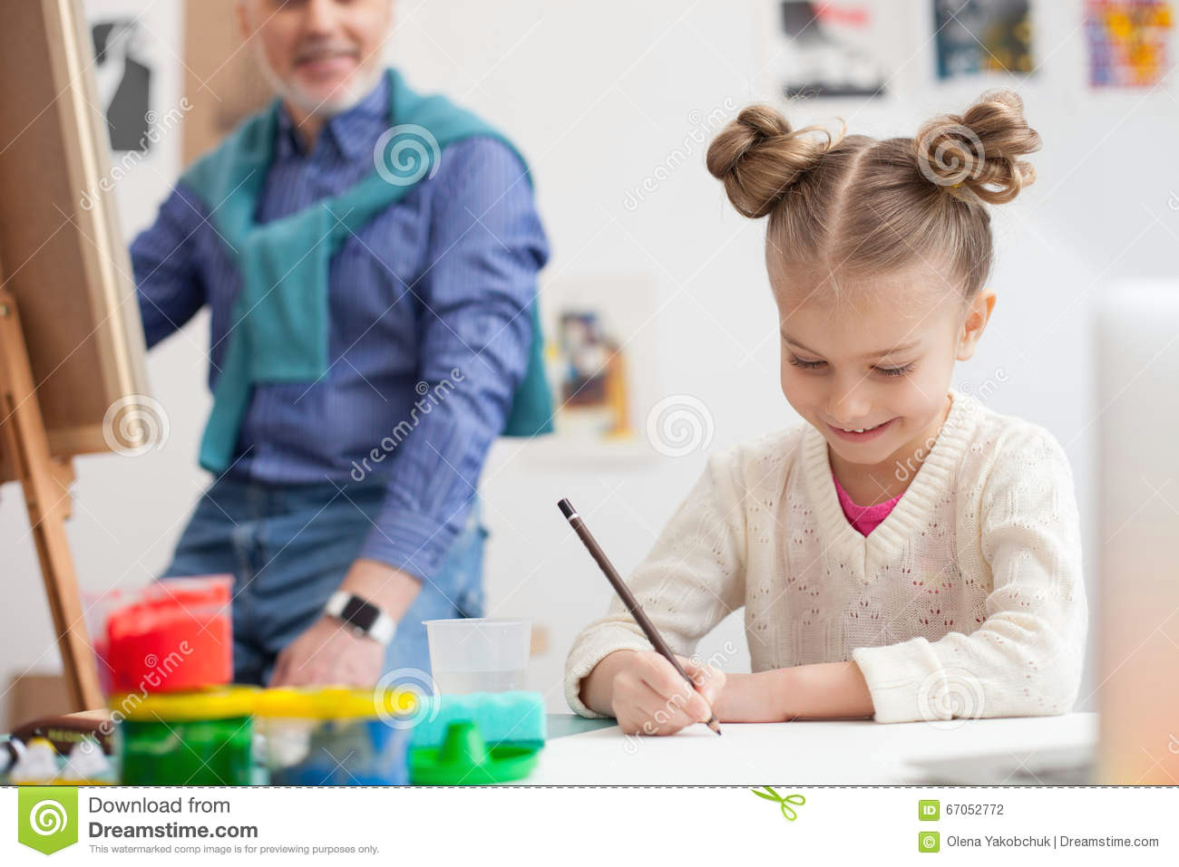 Drawing Of A Girl Sitting at A Desk Cheerful Friendly Family is Painting together Stock Photo Image Of