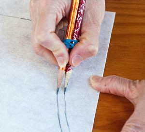 Drawings Of Hands Sewing Two Pencils Rubber Banded together to Draw A Sewing Allowance On A
